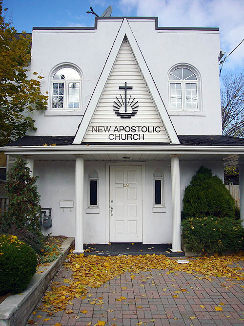 Symmetrical gabled entranceway with Doric columns is labelled NEW APOSTOLIC CHURCH